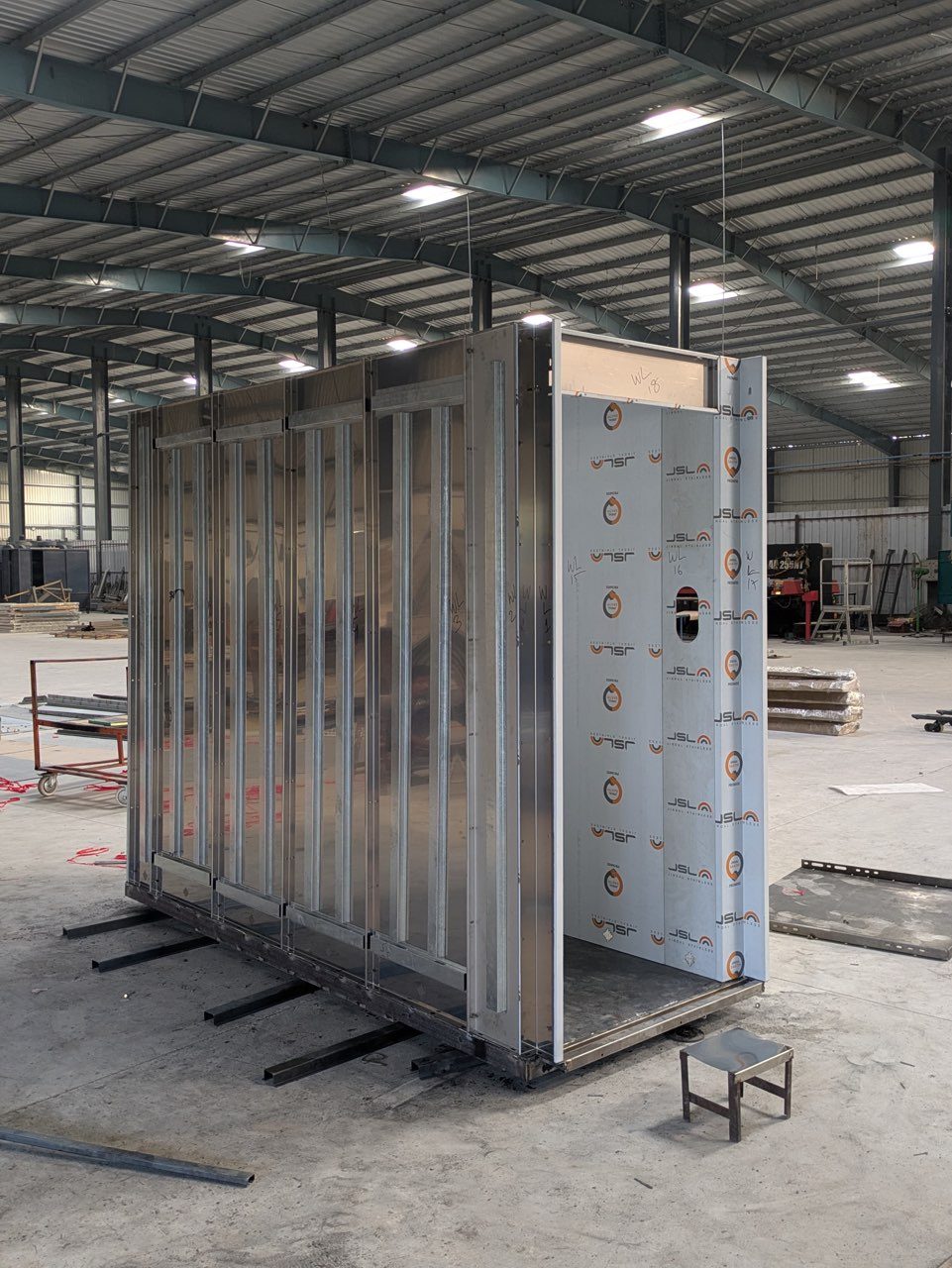 Elevator cabin shell under fabrication in a large factory
